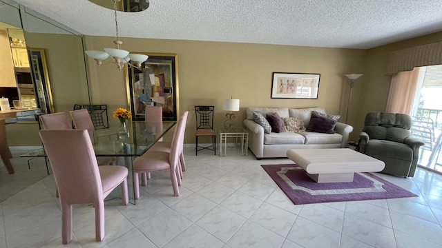 living room featuring a textured ceiling and an inviting chandelier