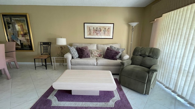 living room with a textured ceiling