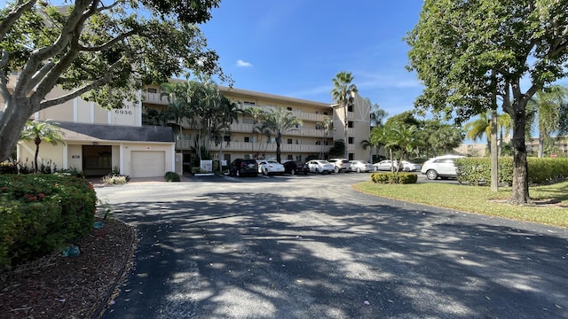 6936 Huntington Ln Unit 405, Delray Beach, FL 33446 - view of building exterior featuring an attached garage