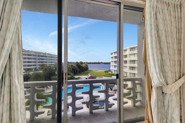 balcony featuring a water view