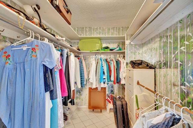 spacious closet with light tile patterned floors