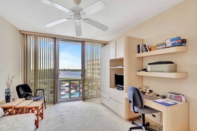 office with light carpet, a textured ceiling, and ceiling fan