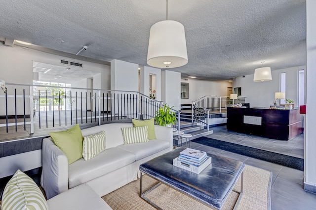 living room with a textured ceiling