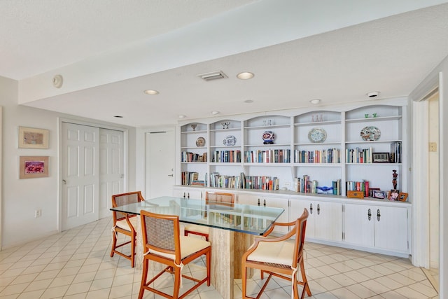 tiled dining room with a textured ceiling