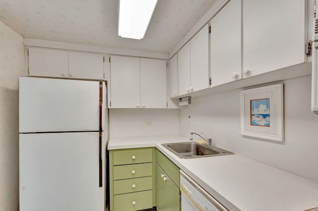 kitchen featuring white cabinetry, sink, white appliances, and green cabinetry