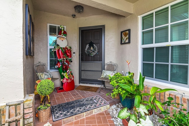 entrance to property featuring a porch