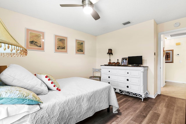 bedroom featuring dark hardwood / wood-style floors and ceiling fan