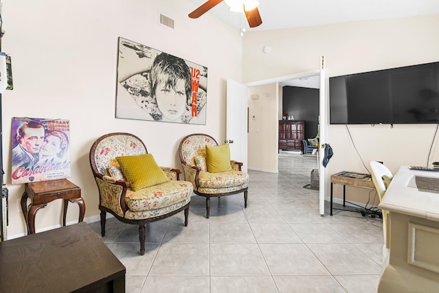 sitting room featuring ceiling fan and light tile patterned floors