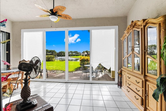 sunroom with a wealth of natural light and ceiling fan