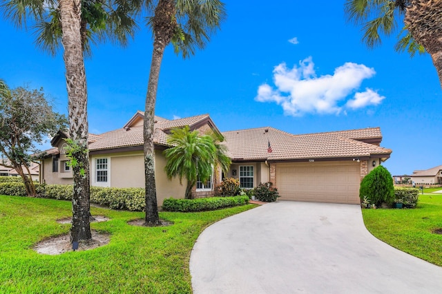 view of front facade with a front lawn and a garage