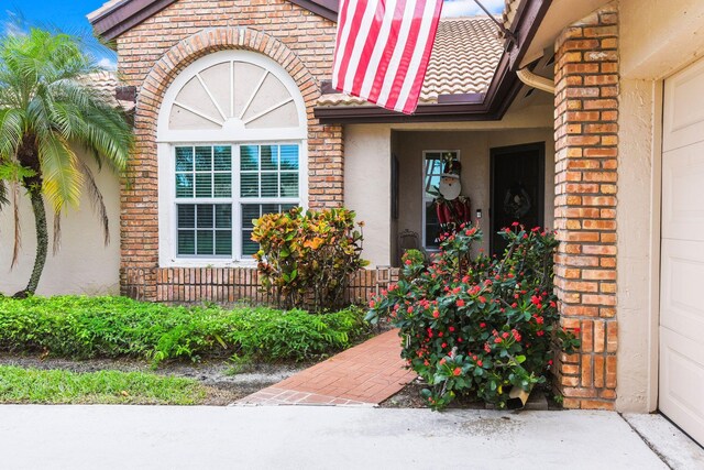 view of front of house with a front yard and a garage