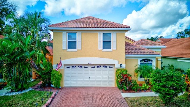 mediterranean / spanish-style house featuring a garage