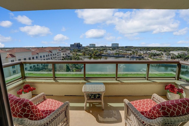 balcony featuring a water view