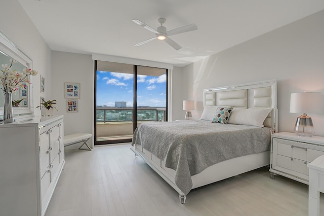 bedroom with ceiling fan and light hardwood / wood-style flooring