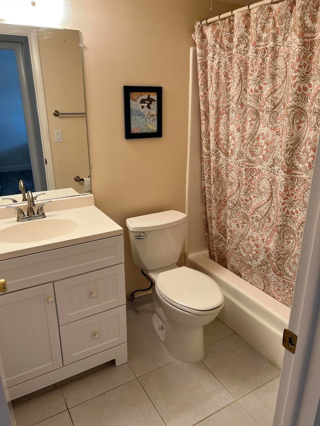 full bathroom featuring tile patterned floors, vanity, toilet, and shower / tub combo