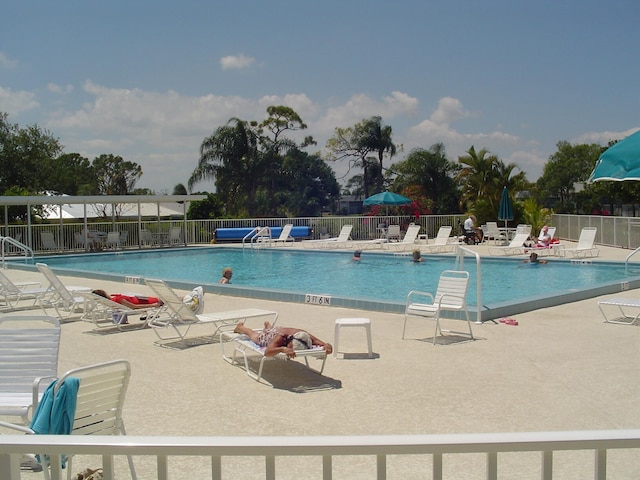 view of swimming pool featuring a patio area