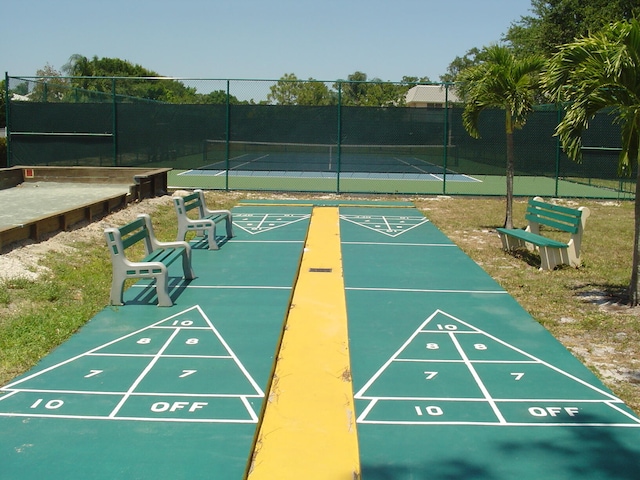 surrounding community featuring tennis court