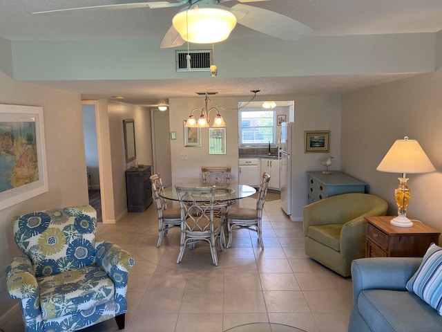 tiled dining space featuring ceiling fan