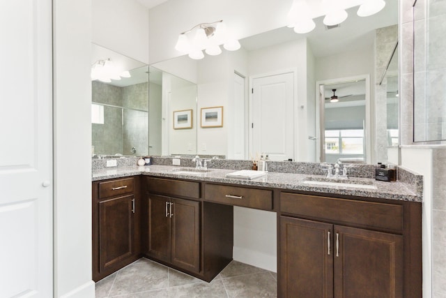 bathroom featuring tile patterned flooring, vanity, walk in shower, and ceiling fan