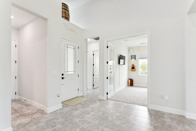 hallway with light tile patterned flooring