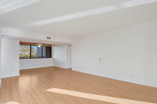 spare room featuring light hardwood / wood-style flooring