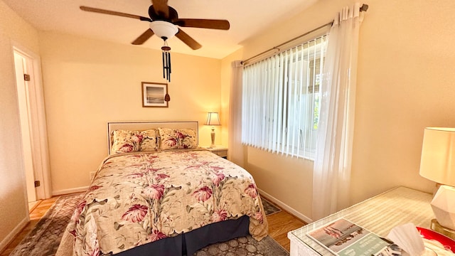 bedroom featuring ceiling fan and light wood-type flooring