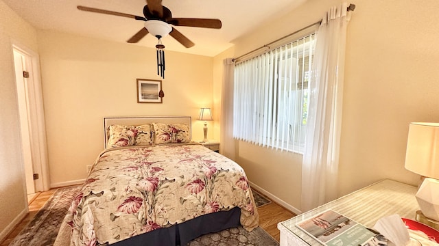 154 Lake Meryl Dr Unit 257, West Palm Beach, FL 33411 - bedroom with wood finished floors and ceiling fan