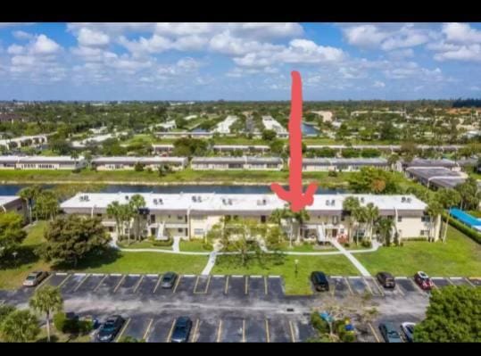 154 Lake Meryl Dr Unit 257, West Palm Beach, FL 33411 - aerial view of property and surrounding area featuring a large body of water