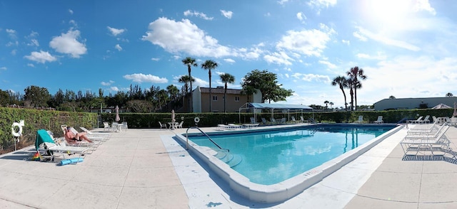 view of swimming pool featuring a patio