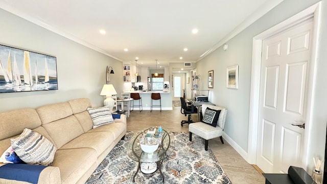 living room with light hardwood / wood-style floors and ornamental molding