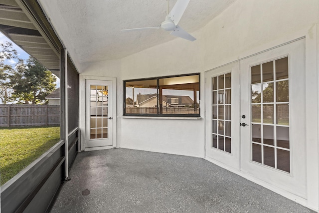 unfurnished sunroom with french doors, vaulted ceiling, and ceiling fan