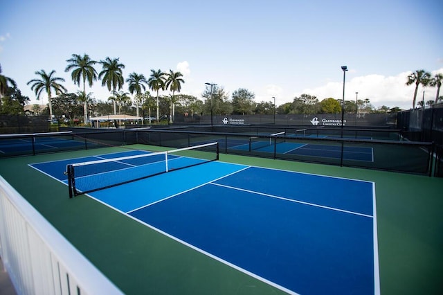 view of sport court with basketball hoop