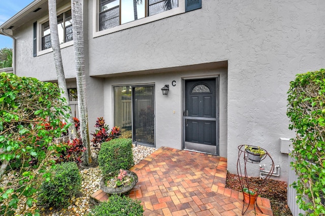 doorway to property featuring a patio