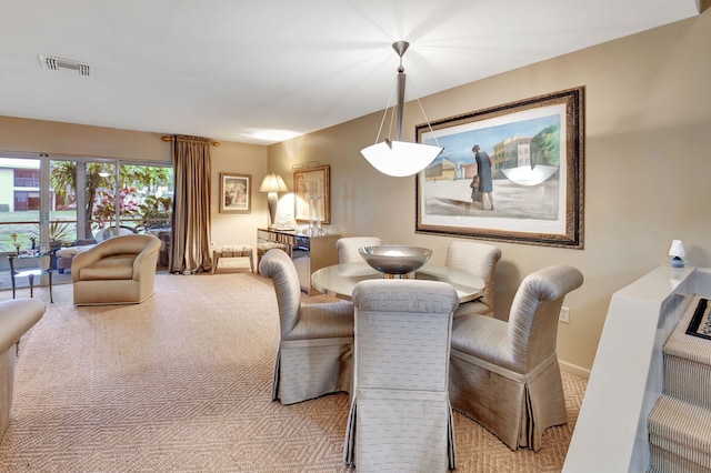 view of carpeted dining area