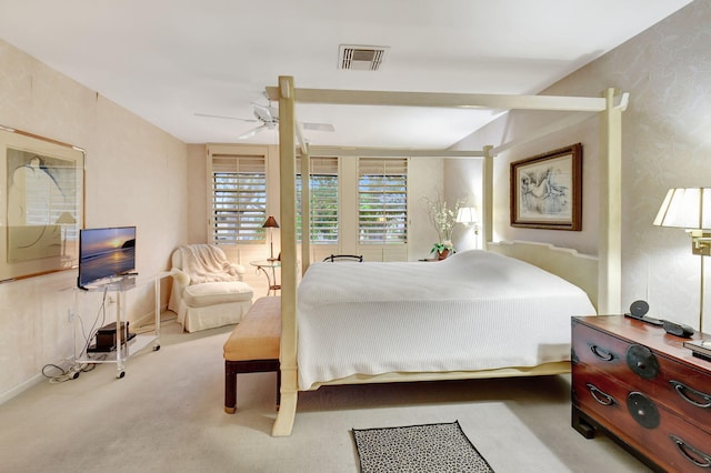 bedroom with ceiling fan and light colored carpet