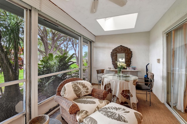 sunroom with ceiling fan and a skylight