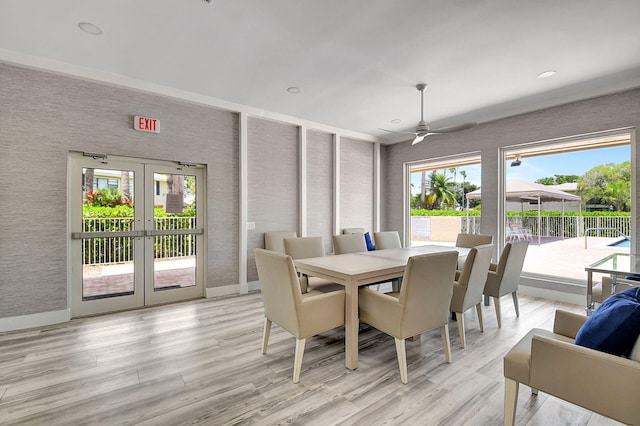 dining area with french doors, light hardwood / wood-style floors, and a wealth of natural light