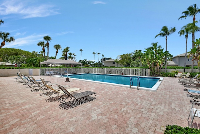 view of swimming pool with a patio