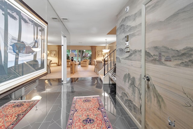 hall featuring dark tile patterned floors