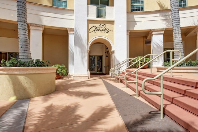 610 Clematis St Unit 638, West Palm Beach, FL 33401 - view of exterior entry featuring french doors and stucco siding