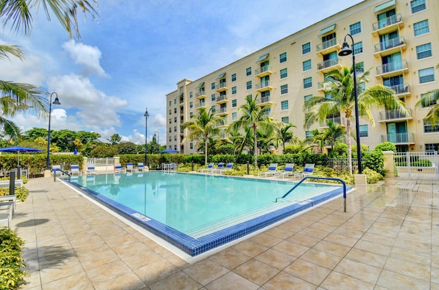 view of swimming pool with a patio area