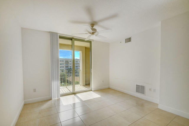 610 Clematis St Unit 638, West Palm Beach, FL 33401 - tiled spare room with a ceiling fan and baseboards