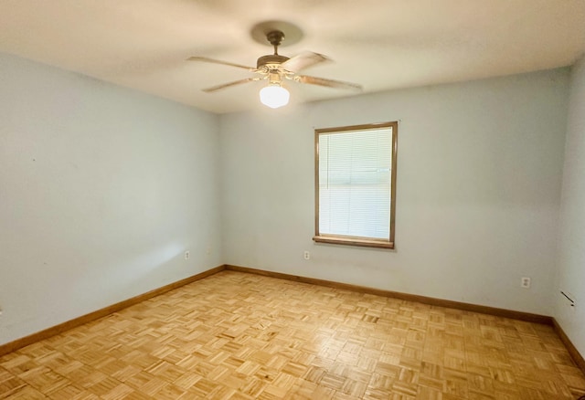 unfurnished room with light parquet floors and ceiling fan