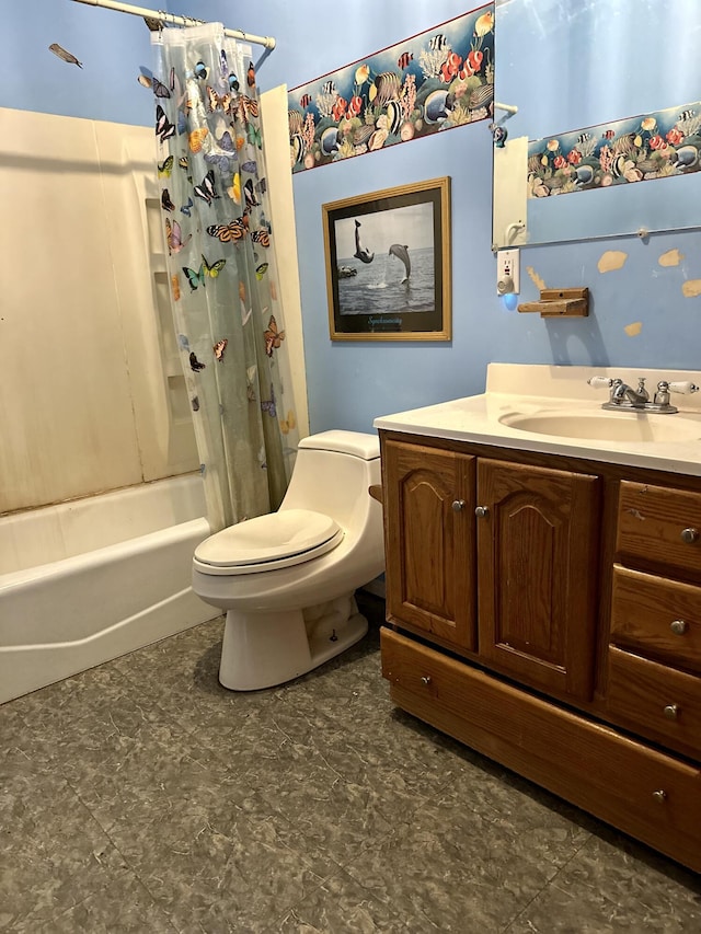 full bathroom with vanity, shower / tub combo, and toilet