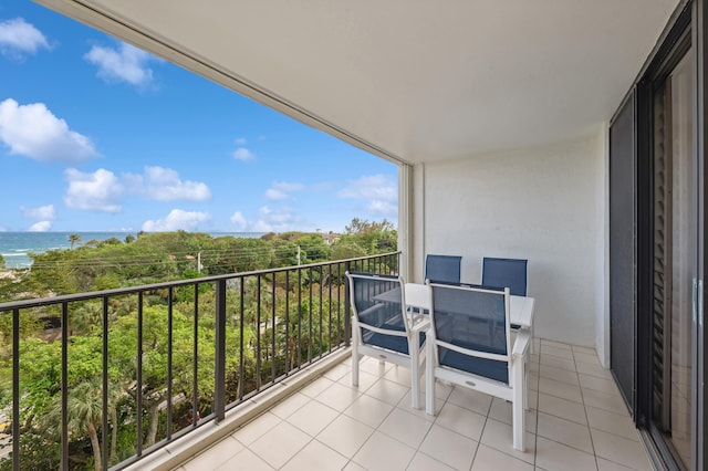 balcony featuring a water view