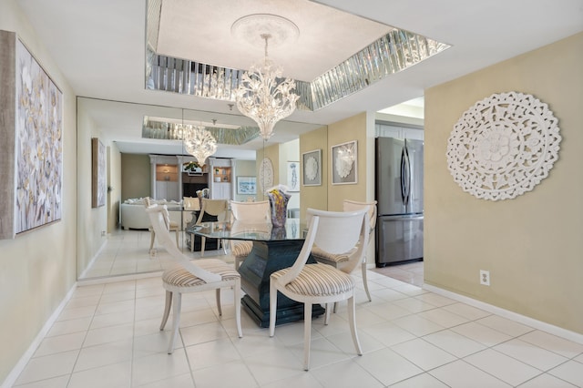 dining room with an inviting chandelier and light tile patterned flooring