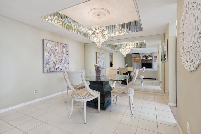 tiled dining area featuring an inviting chandelier