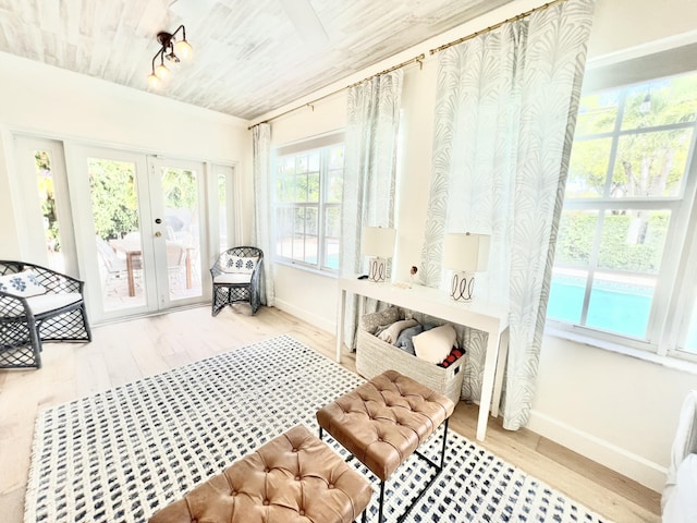 mudroom featuring wood ceiling, baseboards, wood finished floors, and french doors