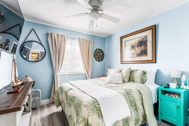 bedroom with hardwood / wood-style flooring and ceiling fan