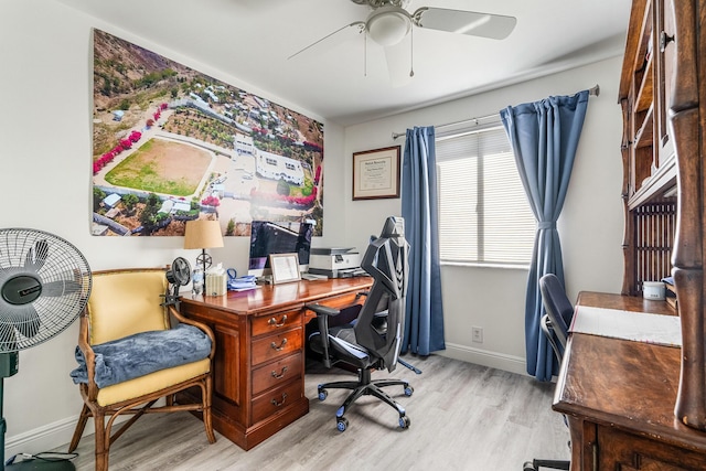 office with ceiling fan and light wood-type flooring